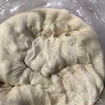 The basic hand kneading technique of bread dough.