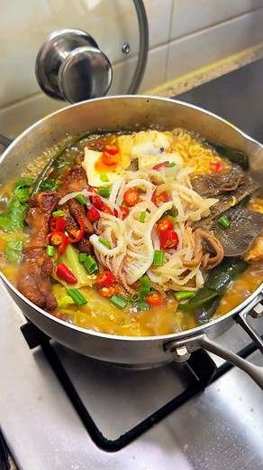 A hearty and spicy hot pot with eggs, various meats, seafood, vegetables, and instant noodles, perfect for a warming meal! #reelschallengereelschallenge #viralreelsシ #fypシ #foryoupage #foodblogger #fyp #viralchallenge #breakfast #satisfying #love | Watch More