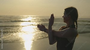Positive, Beautiful Sporty Girl Doing Exercises Outside on Sunset. The Trainer Warms Up the Muscles Before the Training, Including Hand Exercises. Physical Training Concept