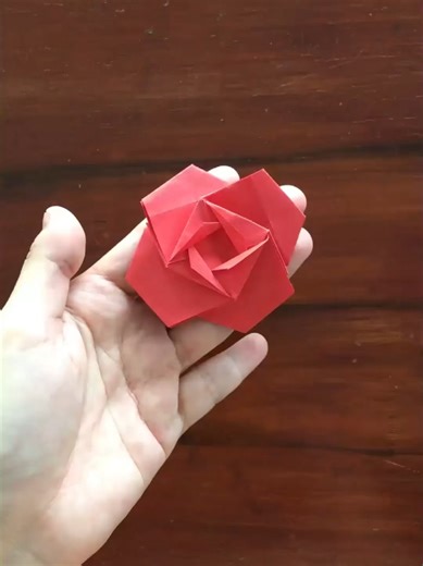 Watch a simple piece of paper bloom into a beautiful rose. #origamirose #paperrose #diyflowers #tiktokdiy #flowertutorial