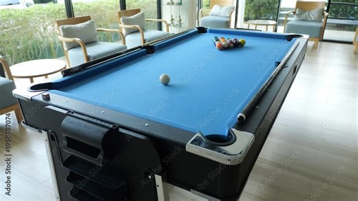A standard size pool table is located in the hotel. Provide services to guests