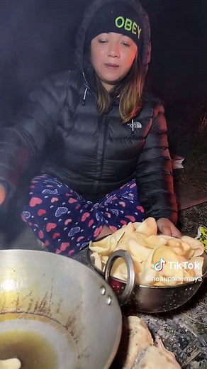 Outdoor Cooking: Women Gather for Campfire Meals