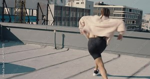 woman dancing on roof top girl performing hip hop dance style having fun freestyle dancer in urban city