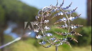 Kinetic wind sculpture, moving fashion garden decoration, art design. Weather vane. Roundabout. Slow motion