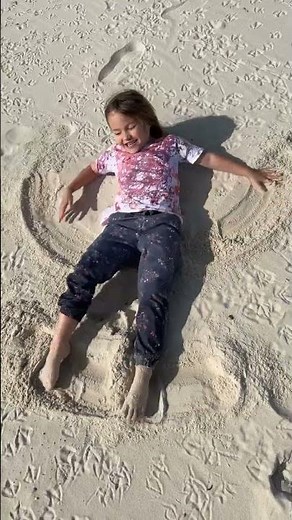 Making sand angels in the winter time
