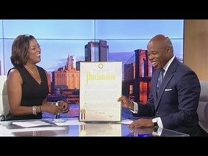 Mayor Eric Adams congratulates Lori Stokes on retirement