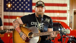 Legendary rock band Lynyrd Skynyrd wrote their song "Red, White and Blue" shortly after the September 11th attacks. The chorus' lyrics, "Guess you could say, we've always been red, white and blue," still ring true to this day. Watch Jesse Keith Whitley perform it. | Country Music Nation