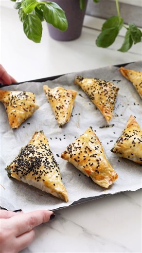 Spanakopita with spinach and cheese, crispy on the outside, rich and creamy on the inside.