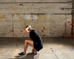 The Prisoner Get Up 🚓 From a standing position, step into a back lunge, and then tuck the rear foot under your hips so you can lay onto your back. To reverse the movement, do a sit up, transition to a single kneeling position, and stand up. You can vary the difficulty of this movement by using different arm positions. You can hold your arms out front, zombie style, to make it easier. You can also do hands on hips, hands behind head, or arms at T. I count the ability to transition between lying,