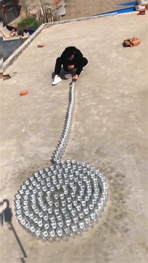 Creative Bottle Art on Rooftop Spiral Design