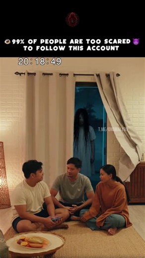 t.me/onomaly99 Living room camera, family dinner time. Parents and child sitting cross-legged on the floor, sharing a meal. Laughter, normal conversation. Behind them, the bedroom door stands open, dark blue light spilling out. At six seconds, a figure appears in the doorway. Tall. Impossibly thin. Long black hair covering its face. It stands perfectly still, watching them. The family doesn't notice. They keep talking, eating. At eleven seconds, it takes one step forward. Camera cuts to static. 