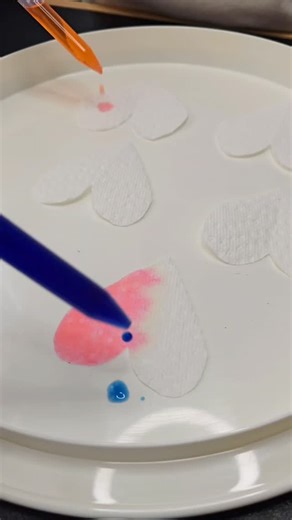 We tried this super simple Valentine’s activity using just paper towels and colored water. I cut out a few shapes, and then we used droppers to drip colored water onto the paper. It’s such a beautiful way to practice color recognition and color mixing — watching the colors blend together and create soft, dreamy patterns on the paper is pure magic. ✨ #valentinesdayactivity #colorlearning #colormixing #kidsactivities #sensoryplay | Nurturing Nuggets