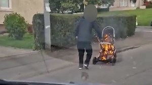 Bizarre moment man is filmed pushing burning pram along Glasgow street