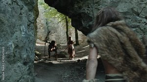 Group of primitive prehistoric hunter-gatherers hunting for food together in the woods. Ancient aboriginal tribe at hunting. Life of savage.