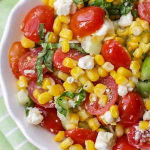 2.4M views · 2.6K reactions | SUMMER CORN SALAD - a flavorful salad filled with corn, tomatoes, feta, basil and cucumber. It's perfect for BBQs and will be a hit at any party! FULL RECIPE: https://lilluna.com/summer-corn-salad/ For more yummy recipes, be sure to follow Lil' Luna - Kristyn Merkley!! | Lil' Luna - Kristyn Merkley | Facebook