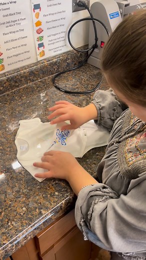 Olivia had a productive day learning how to use our sublimation press to make baby onesies! This is just the start of something beautiful! Stay tuned to find out where all of these onesies will be going. 💛💙 | GiGi’s Genesis Health Bar
