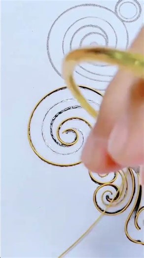 Shaping thin wire into decorative patterns with precise hand work #popular #art #skills