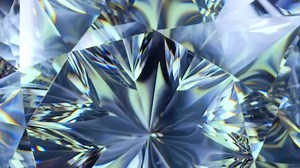 Close up of the faces of a rotating diamond showing the refraction and dispersion effects. 3D Render