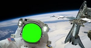 Green Screen Astronaut Spacewalk with Space Shuttle on Space Station Over Earth some elements furnished by NASA images. The astronauts face has been green screen, so you can put someone else's face
