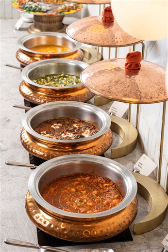 Summer vacation calls for family lunch dates! If you are planning for one, it's time to try our Lavish Copper Lunch Buffet. Truly lavish, our buffet is a festive spread meant to cater to every palate in your clan. From soups, fresh salads, live tawa counter, curries, biryanis, Indian breads to desserts - each member gets to relish their picks. Our live chaat counter is one to halt for! Reserve your buffet table right now. PS: Available at our select outlets only. We recommend checking with the r