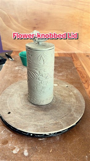 Tall Textured Clay Jar with Flower-Knobbed Lid