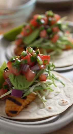 Perfectly Grilled Fish Tacos with Vibrant Fresh Salsa Ingredients 4 servings For the Fish Marinade: 1½ lbs firm white fish fillets (such as cod, tilapia, or mahi-mahi), cut into 1-inch wide strips 2 tablespoons olive oil 1 tablespoon lime juice (freshly squeezed) 1 teaspoon chili powder ½ teaspoon ground cumin ½ teaspoon dried oregano ¼ teaspoon salt ¼ teaspoon black pepper For the Fresh Salsa: 2 large ripe Roma tomatoes, finely diced ½ red onion, finely minced 1 jalapeño, seeded and minced (opt