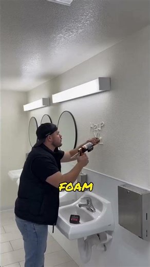 The man painted a picture on the wall, then hung a mirror on it to cover it up