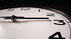 Premium stock video - Zoom out, closeup - modern unbranded clock in timelapse