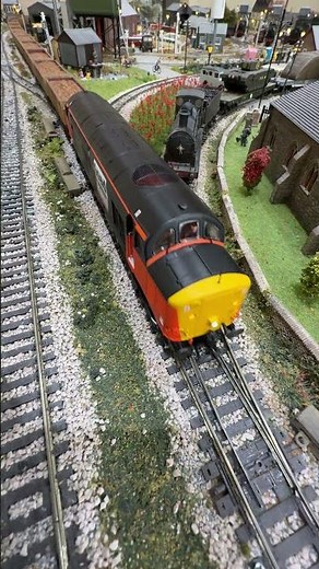 Heading down the back straight Loadhaul 37710 pulling mineral freight train.