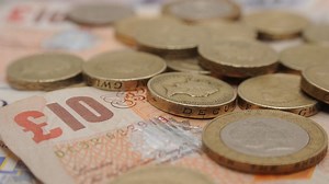 Pound falls after remarks by Theresa May on a 'hard Brexit'