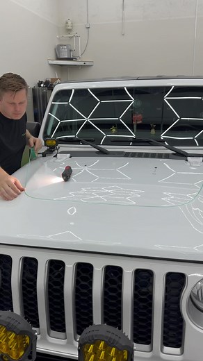 Jeep gladiator hood graphic with knifeless tape 💯 Who ever posted about using a light like this to highlight body lines it works great. Get a free quote nswraps.com . . . #wraps #carwrap #wrapping #wrapped #satisfying #jeep #jeepnation #vinylwrap #jeepgladiator #wrappers | NS Wraps