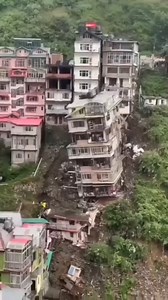 Close-up of collapsed house. | Media 2