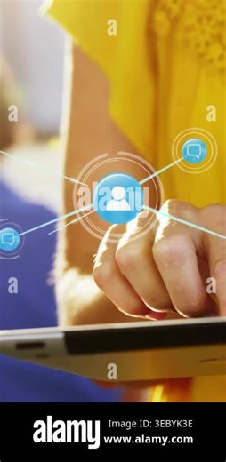 Vertical video: Man tapping tablet and animating UI icon linking messages into dense social network. Connectivity, interaction, device, interface, visualization, mesh, vertical video Stock Video Footage - Alamy
