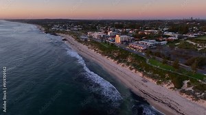 Beautiful Cottesloe beach in the evening with Perth city buildings in the horizon, Western Australia