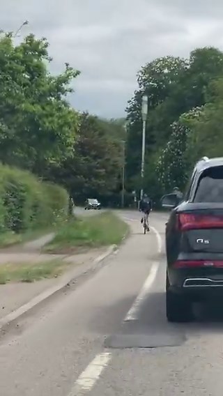 If you ever cycle with someone who is more vulnerable than you and you consider how the typical 2 ton SUV is driven then you will not be confused as to why he's making sure those cars don't pass on a bend