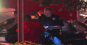 Fight in bar spills into street, causes crash