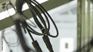 Solar panels at substation. Cables prepared to plugs sun energy collecting cells at substation construction site extreme close view