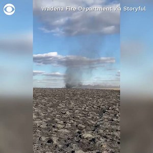The right combination of winds and dry weather during a controlled fire burn led to the formation of a dust devil in Wadena, Minnesota, on Monday. | CBS News