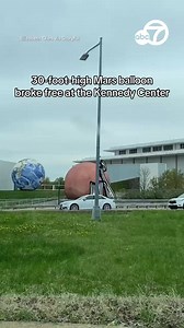 A 30-foot-high balloon designed to look like Mars broke free and rolled onto a nearby highway. The balloon is positioned outside the Kennedy center and was apart of the center’s “Celestial Bodies: Earth, Moon, Mars” exhibit. | ABC7 News