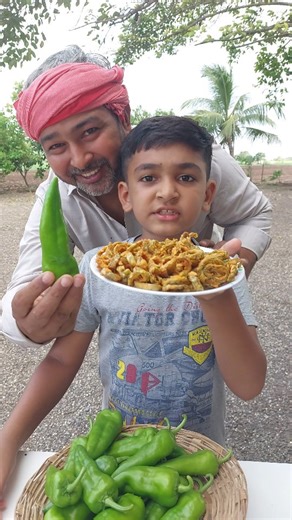 Village Cooking Boy on Instagram: "Crispy Mirchi Ring Bhajiya 🌶😋 Bap-Bete ki Jodi kaisi lagi..? #food #foodie #recipe #recipes #cooking #instafood #yummy #delicious #foodphotography #village #villagelife #villagefood #rain #snacks #chatpatafood #mirchi #bhajji #bhajiya #mirchibhaji #spicy #villagecookingboy"