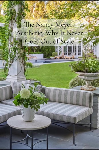 There’s a reason we’re still obsessed with the Nancy Meyers aesthetic. Even her older movies feature homes that feel warm, timeless, and deeply livable — not trendy or over-styled. These interiors are rooted in what designers call modern traditional or warm transitional design. You’ll always see soft, layered neutrals, slipcovered furniture, natural materials like wood and linen, fresh flowers, and spaces that feel collected over time rather than decorated all at once. That’s why these homes sti