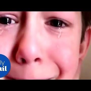 Boy's tooth is pulled out unexpectedly by his little brother - Daily Mail