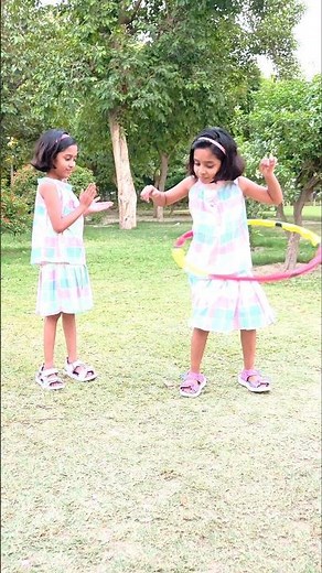 Who Wins the Hula Hoop Challenge? 😆🏆#viral #trending #explore #games #twinsisters