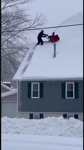 Man Falls Off Roof While Snow Blowing, Lands Safely in Snowbank