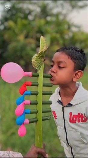 How to make a Musical Instrument with Palm Leaf Stem & Balloon