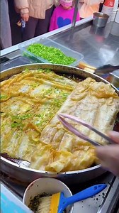 If I didn't tell you, who would know this is a savory scallion pancake?#streetfood #shorts