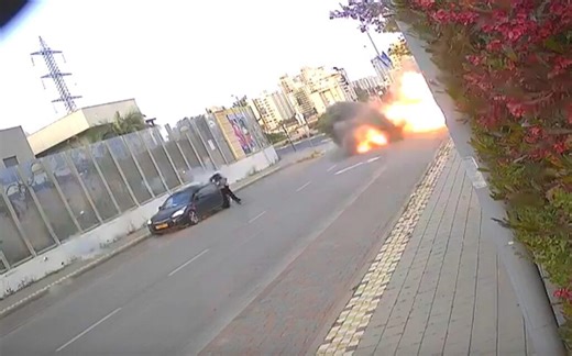 Moment Israeli woman knocked to the ground as missile explodes right next to her