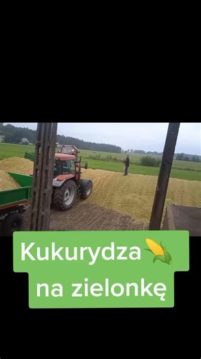 Tractor Unloading Hay in Rural Agriculture Setting