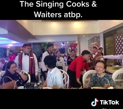 The Singing Cooks and Waiters: A Chef Chopping While Singing