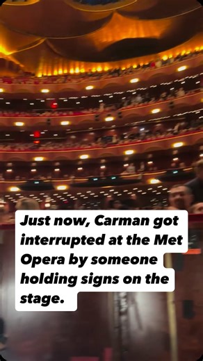 Wen Qian on Instagram: "Just happened! Metropolitan Opera #Carmen performance got interrupted by protestors jumped onto the stage. There are people in the audiences shouting. Shocking! Don’t know yet what they are protesting for. We will find out from the news soon! #metoperaorchestra #carmen #protest #metopera"